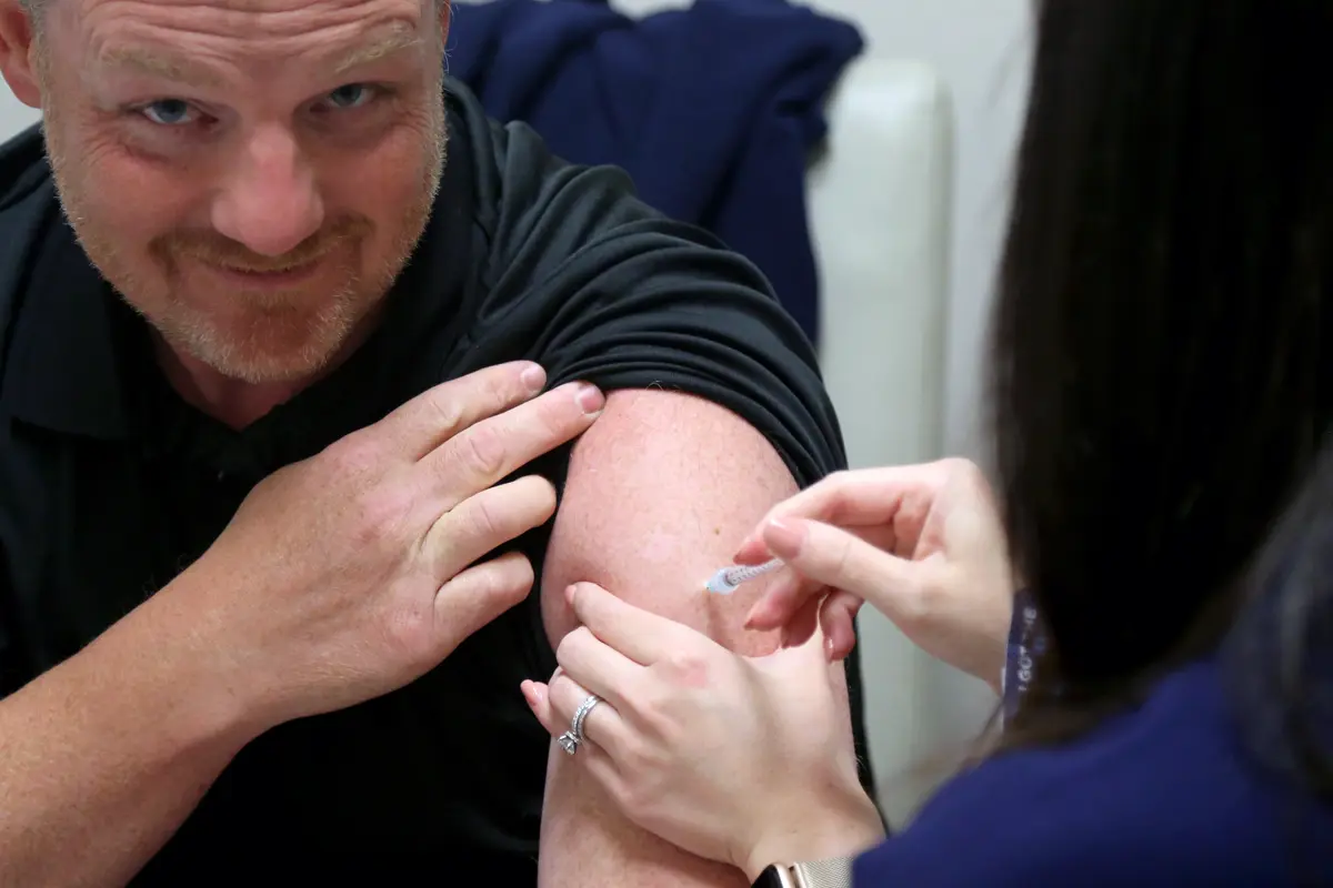 man receiving COVID vaccination